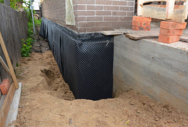 Happy homeowners after waterproofing job in McCordsville